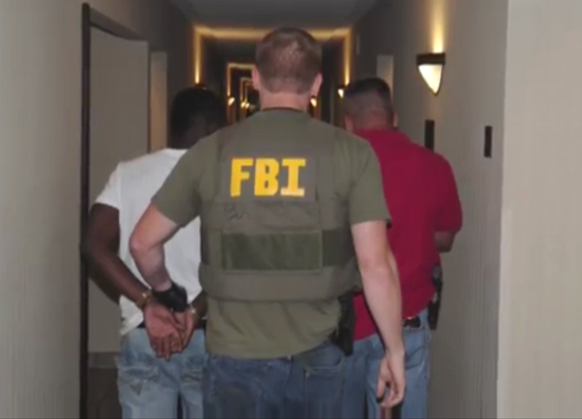 Authorities raid a hotel in Jackson, Miss., in July 2014.