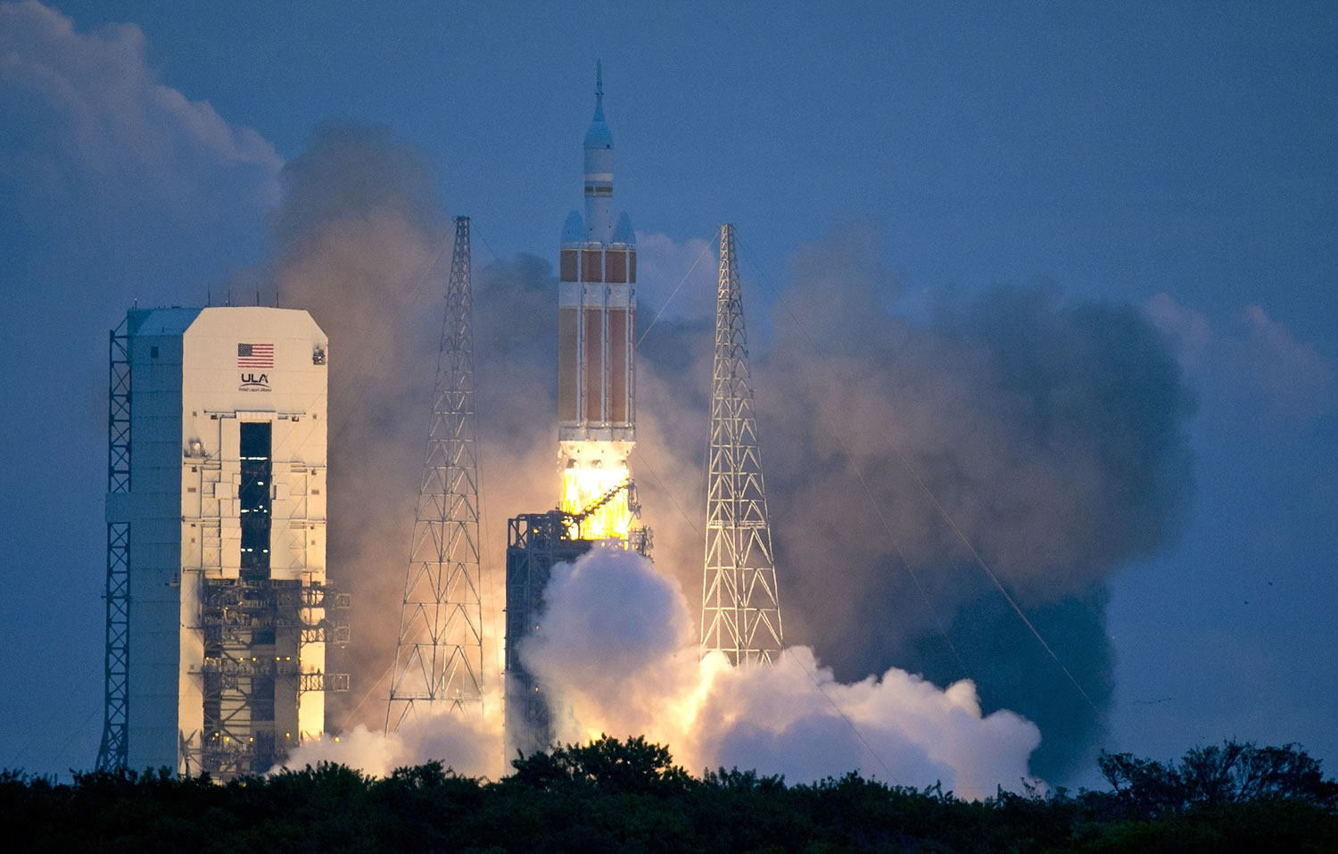 The NASA Orion space capsule atop a Delta IV rocket, in its first unmanned orbital test flight, lifts off from the Space Launch Complex 37B pad at the Cape Canaveral Air Force Station on Friday, Dec.