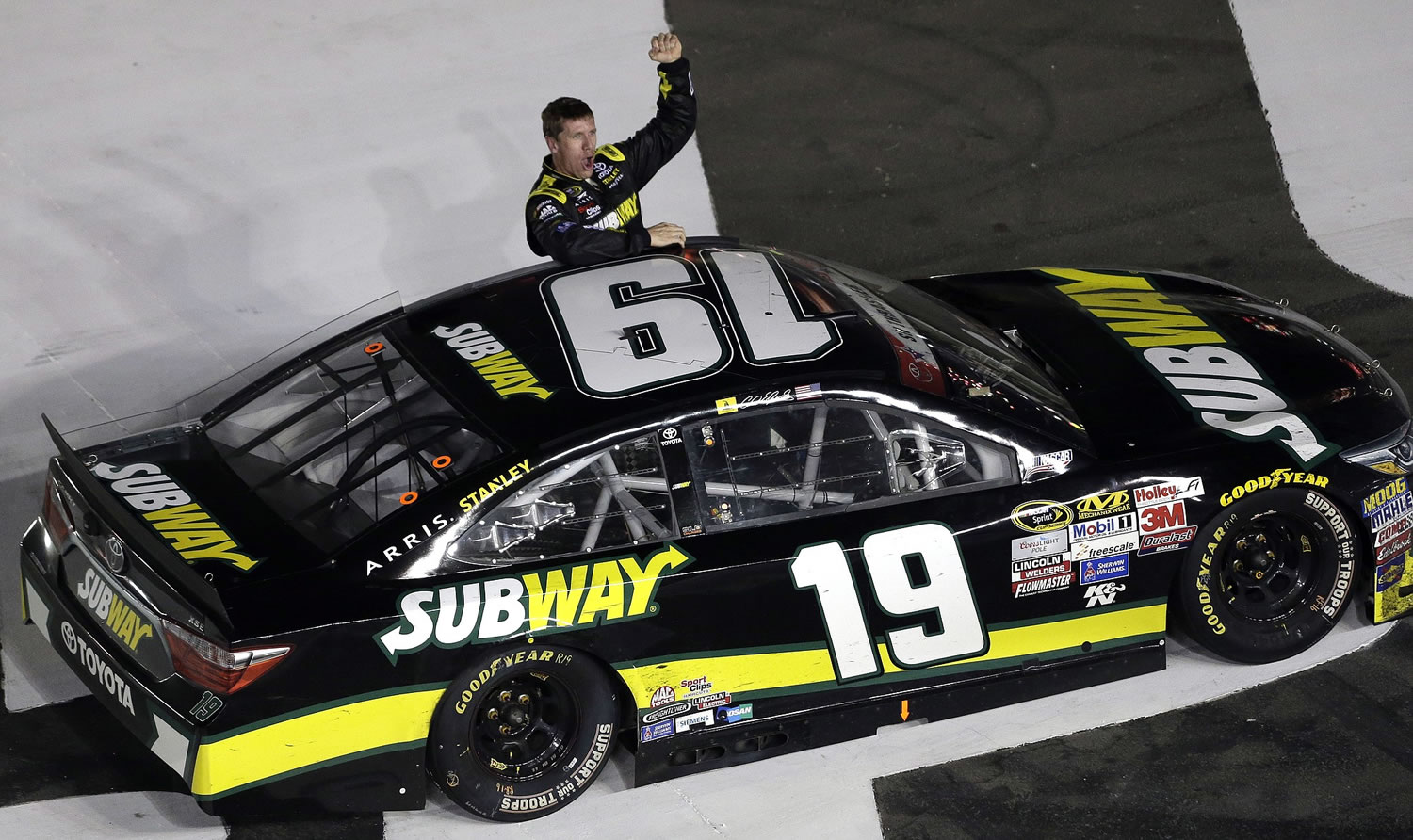 Carl Edwards celebrates after winning the NASCAR Coca-Cola 600 at Charlotte Motor Speedway in Concord, N.C., Sunday, May 24, 2015.