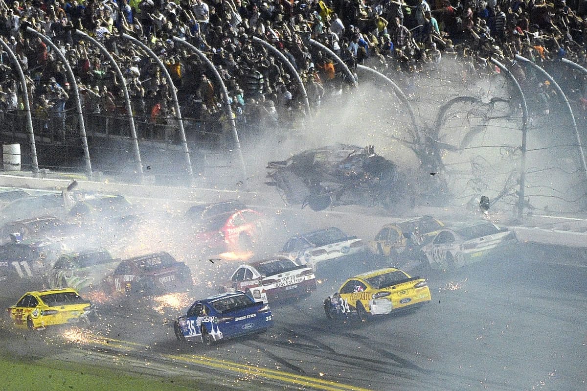 Austin Dillon crashes into the fence after the field crossed the finish line for the conclusion of the Coca Zero 400 on Sunday night at Daytona International Speedway in Daytona Beach, Fla. Dillon was able to walk away from the wreck. (AP Photo/Phelan M.