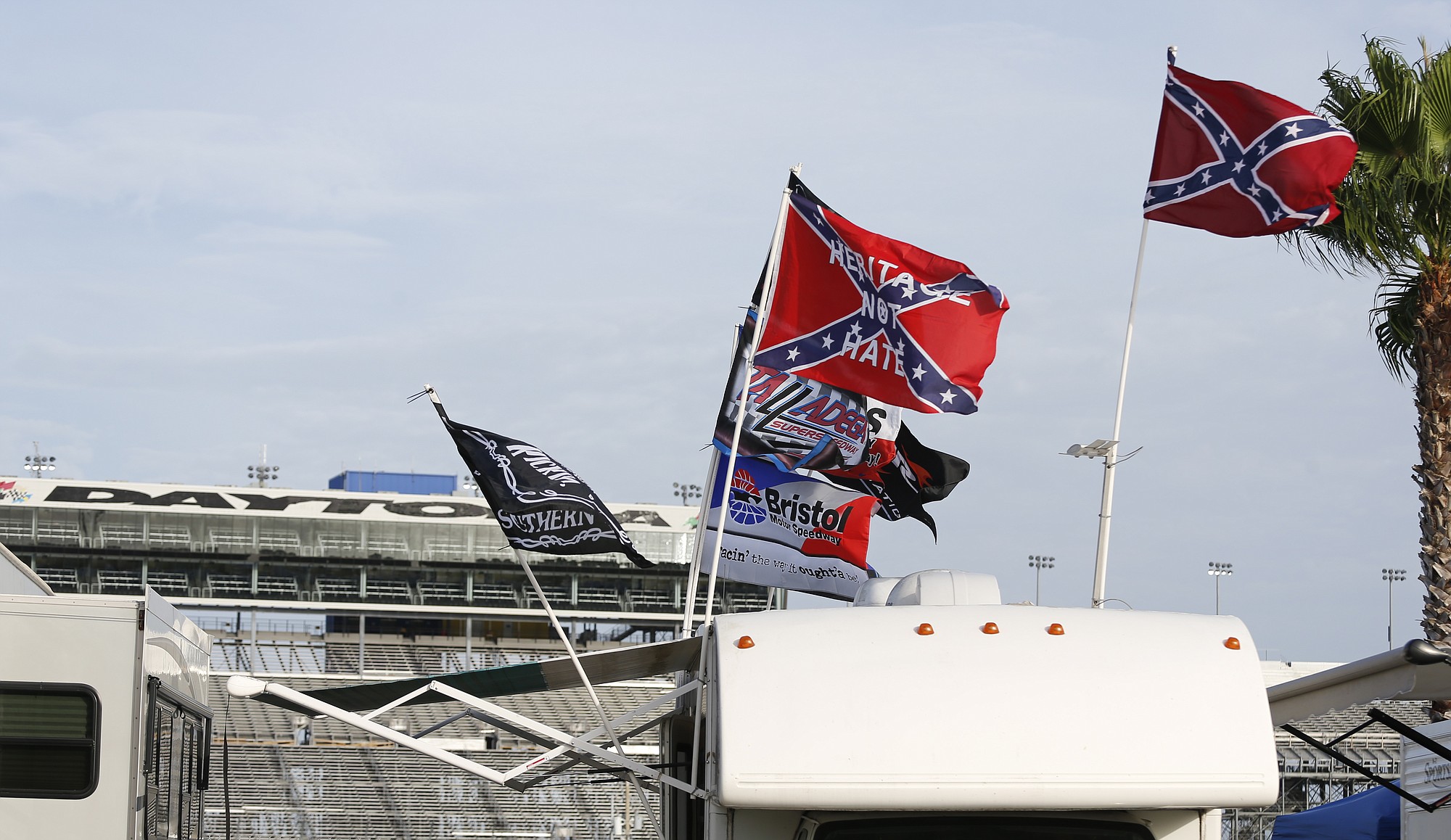 Races fans fly Confederate flags in the infield during a NASCAR Sprint Cup practice session at Daytona International Speedway, Friday, July 3, 2015, in Daytona Beach, Fla.