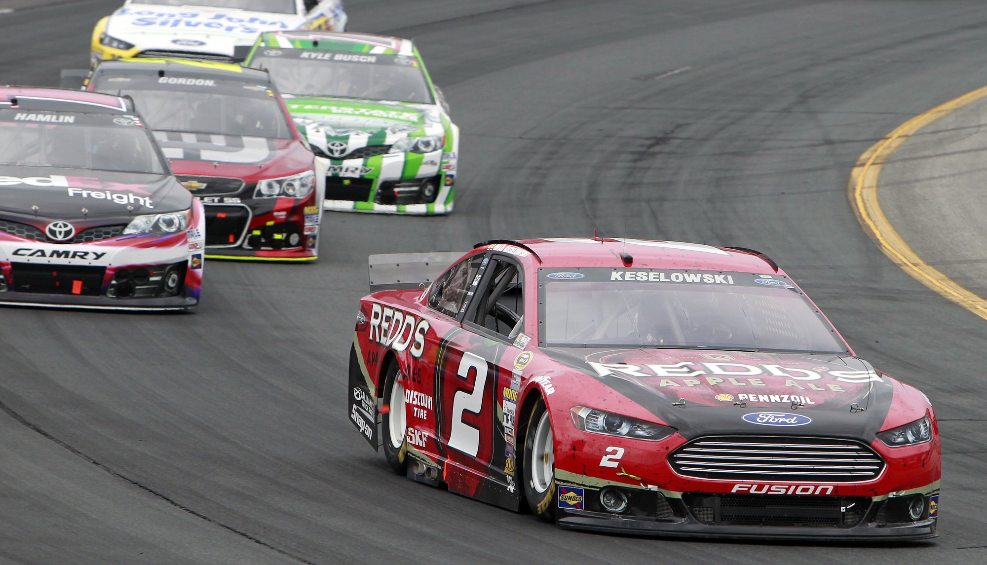 Brad Keselowski (2) leads during the NASCAR Sprint Cup Series auto race at New Hampshire Motor Speedway on Sunday, July 13, 2014, in Loudon, N.H. Keselowski went on to win the race.