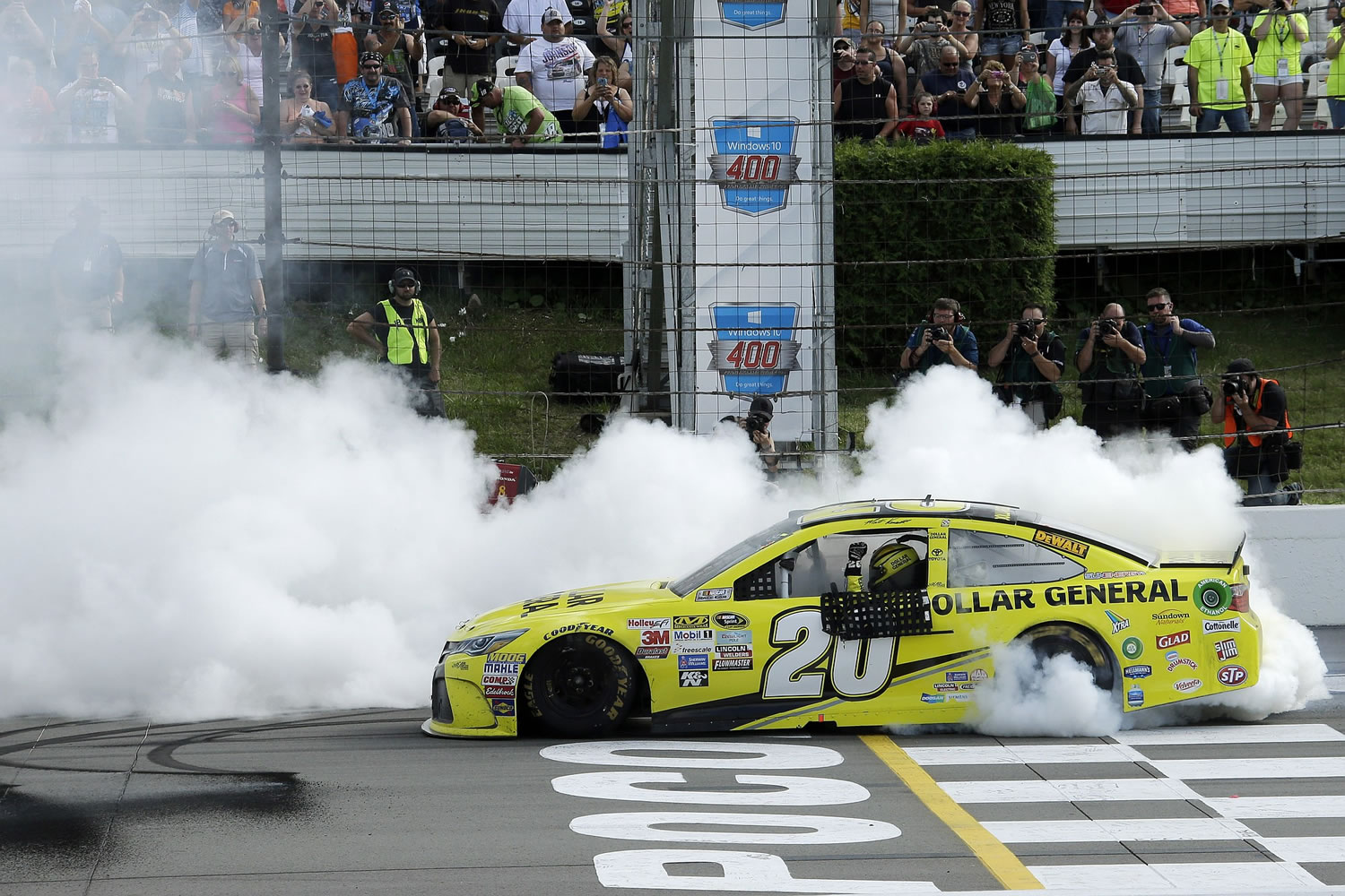 Matt Kenseth smokes his tires after winning the NASCAR Pocono 400 on Sunday, Aug. 2, 2015, in Long Pond, Pa.