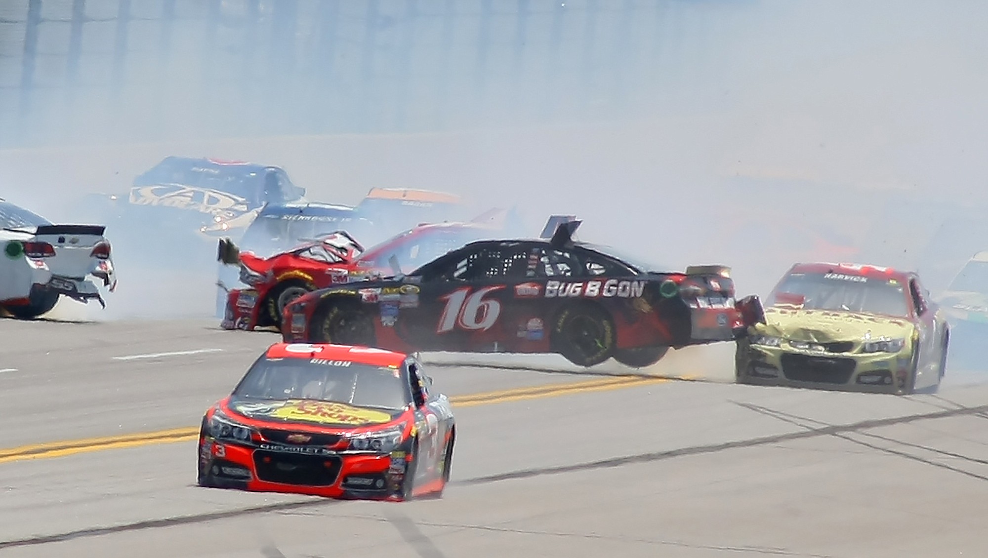 Greg Biffle (16) is lifted by Kevin Harvick, right, in a multi-car crash as Austin Dillon (3) drives past them during the Geico 500 NASCAR Sprint Cup race at Talladega Superspeedway, Sunday, May 3, 2015, in Talladega, Ala. Biffle would finish the race 37th, 41 laps down after his team made repairs to the car.
