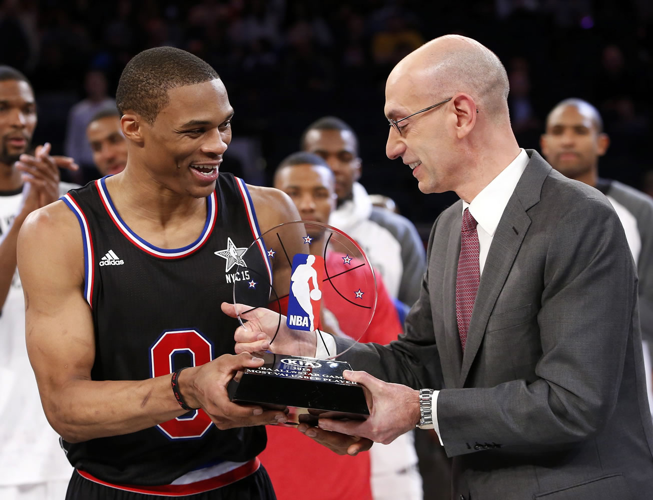 NBA Commissioner Adam Silver, right, hands West Team's Russell Westbrook the MVP trophy after the NBA All-Star Game, Sunday, Feb. 15, 2015, in New York.