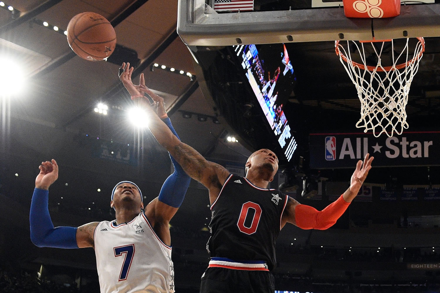 Portland Trail Blazers' Damian Lillard (0), playing for the West team, said he was &quot;surprised&quot; East team's Carmelo Anthony, back, jumped to block his shot on this play during Sunday's All-Star Game at Madison Square Garden.(AP Photo/Bob Donnan, Pool)