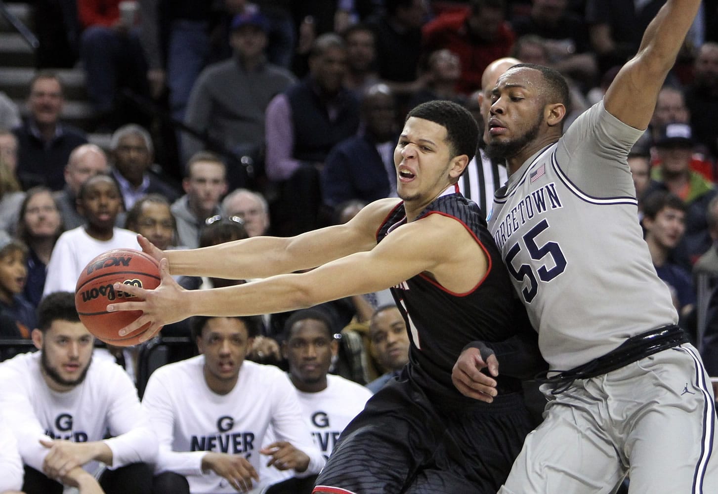 Eastern Washington guard Tyler Harvey, left,holds the ball away from Georgetown guard Jabril Trawick during the first half of an NCAA college basketball second round game in Portland, Ore., Thursday, March 19, 2015.