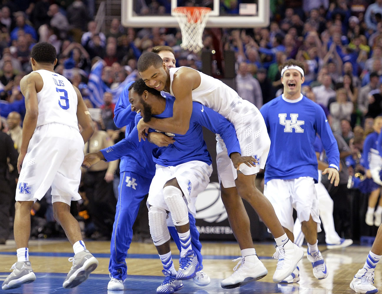 Kentucky players celebrate after a 68-66 win over Notre Dame in a college basketball game in the NCAA men's tournament regional finals, Saturday, March 28, 2015, in Cleveland.