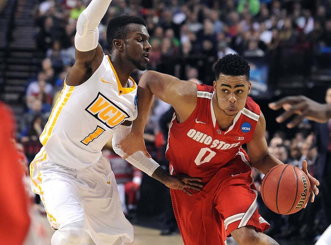 Ohio State guard D'Angelo Russell (0) drives against Virginia Commonwealth's JeQuan Lewis.