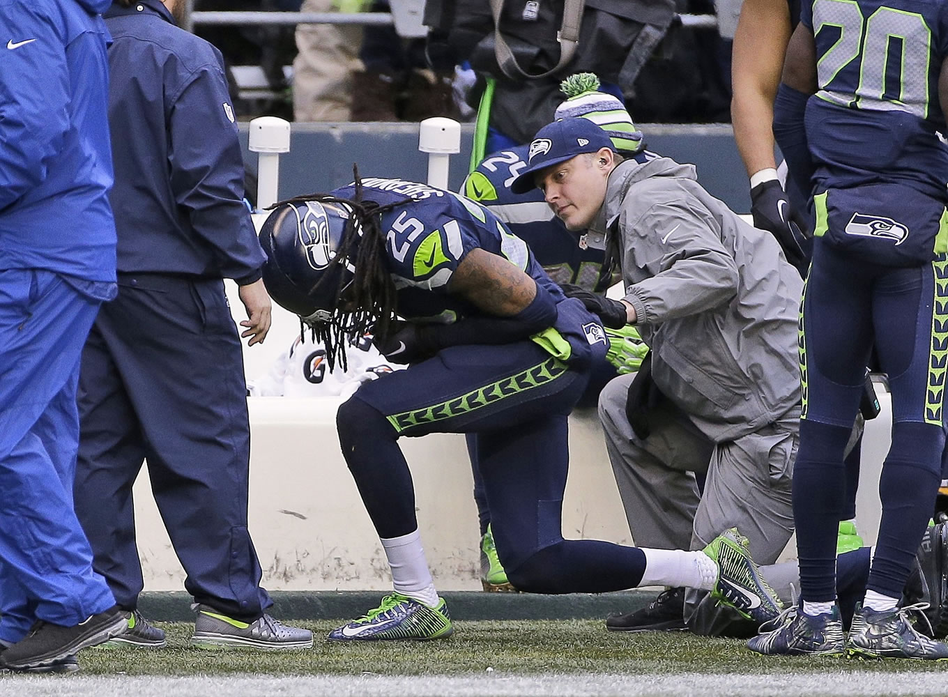Seattle Seahawks' Richard Sherman appears hurt after a play during the second half of the NFL football NFC Championship game against the Green Bay Packers Sunday in Seattle.