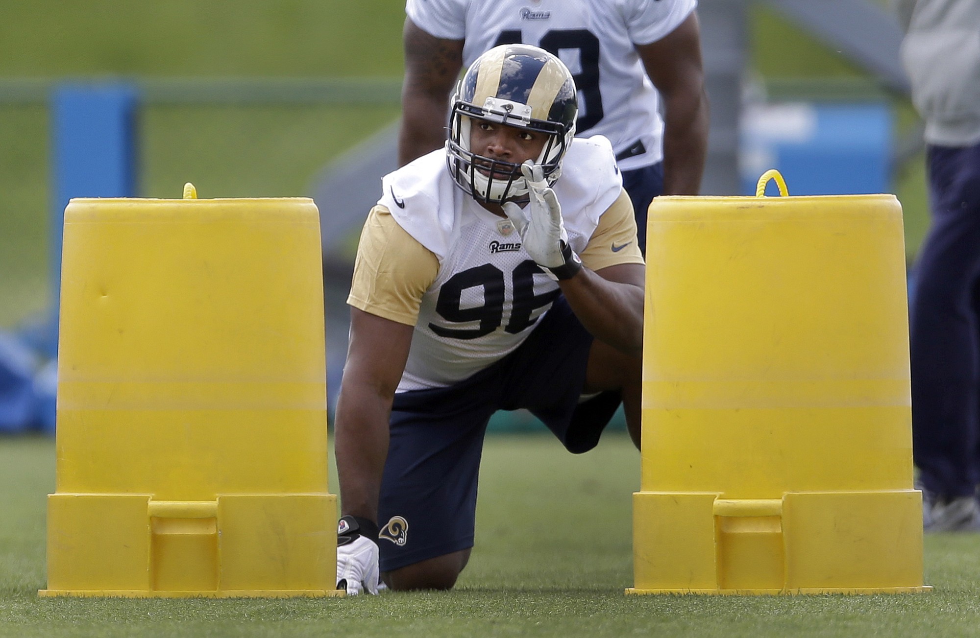 St. Louis Rams seventh-round draft pick Michael Sam takes part in a drill during the team's NFL football rookie camp in St. Louis in May.
