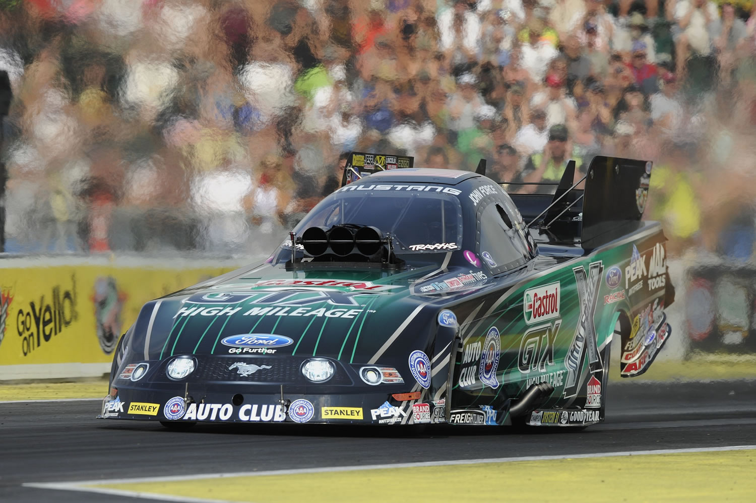 John Force drives in Funny Car qualifying Saturday, Aug. 2, 2014, at the O'Reilly Auto Parts NHRA Northwest Nationals at Pacific Raceways in Kent, Wash. Force went on to victory in Sunday's final eliminations.