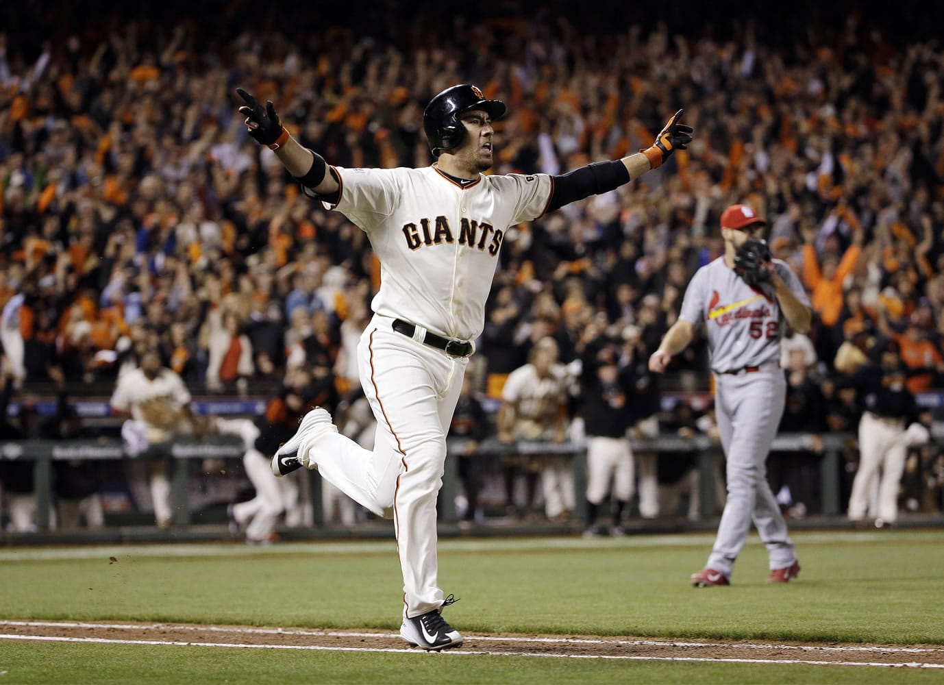 San Francisco Giants' Travis Ishikawa reacts after hitting a walk-off three-run home run during the ninth inning of Game 5 of the National League baseball championship series against the St. Louis Cardinals Thursday, Oct. 16, 2014, in San Francisco. The Giants won 6-3 to advance to the World Series. (AP Photo/David J.
