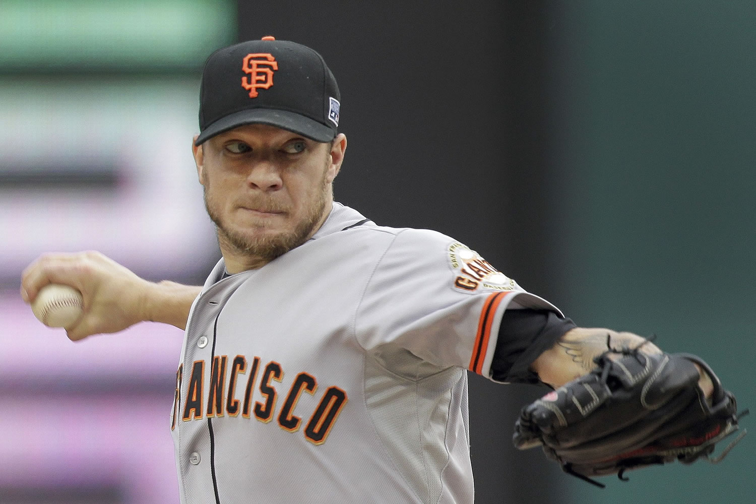 San Francisco Giants starting pitcher Jake Peavy (22) throws in the second inning of Game 1 of the NL Division Series against the Washington Nationals, Friday, Oct. 3, 2014, in Washington.