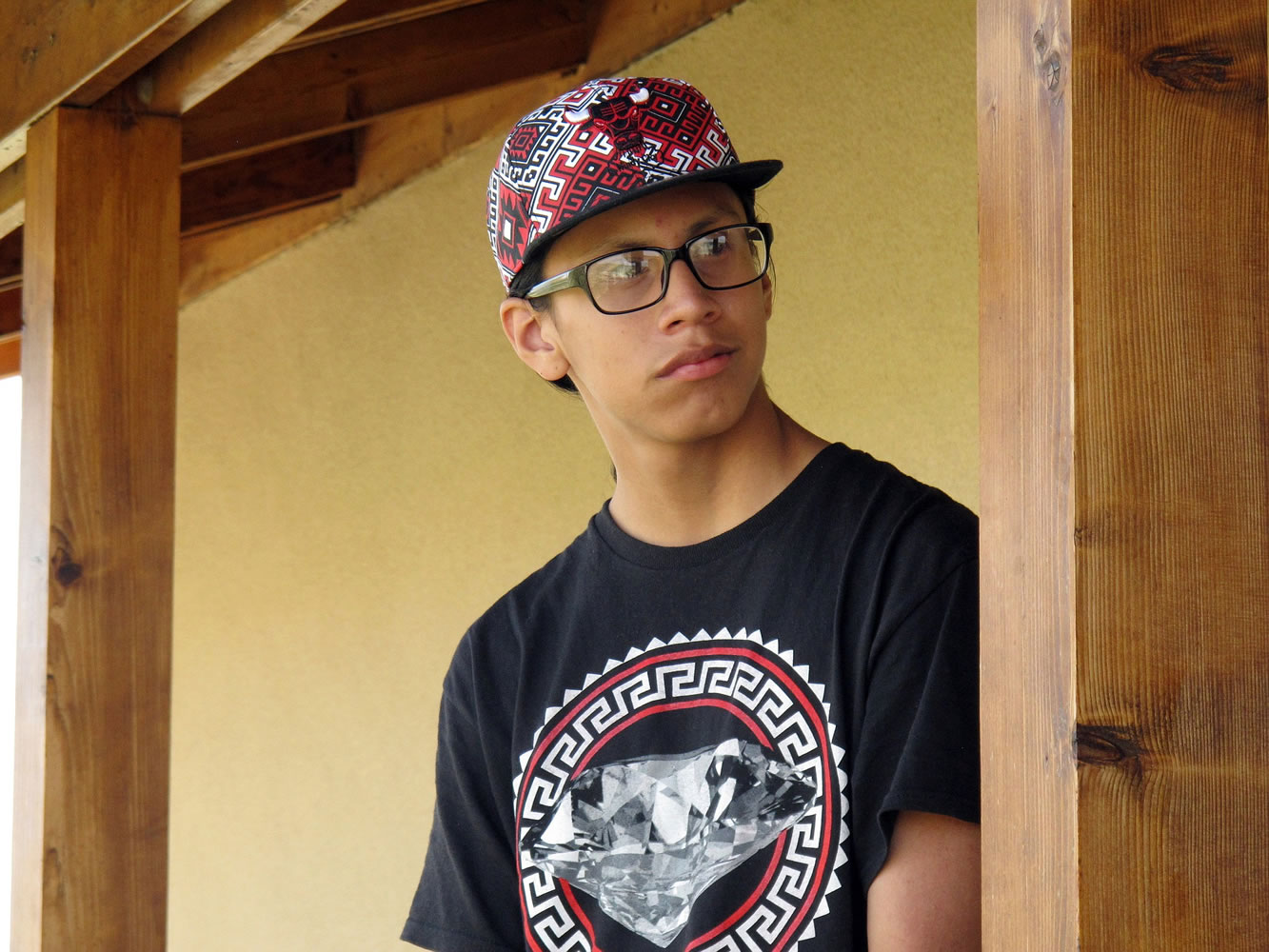 16-year-old Miguel Wambli stands at the Pine Ridge Indian Reservation in Porcupine, S.D.