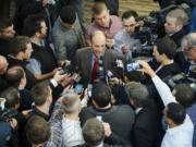 Nebraska's new football coach Mike Riley is swarmed by the media after a news conference at Memorial Stadium on Friday, Dec. 5, 2014 in Lincoln, Neb. Riley, who came from Oregon State, replaces Bo Pelini who was fired last Sunday.