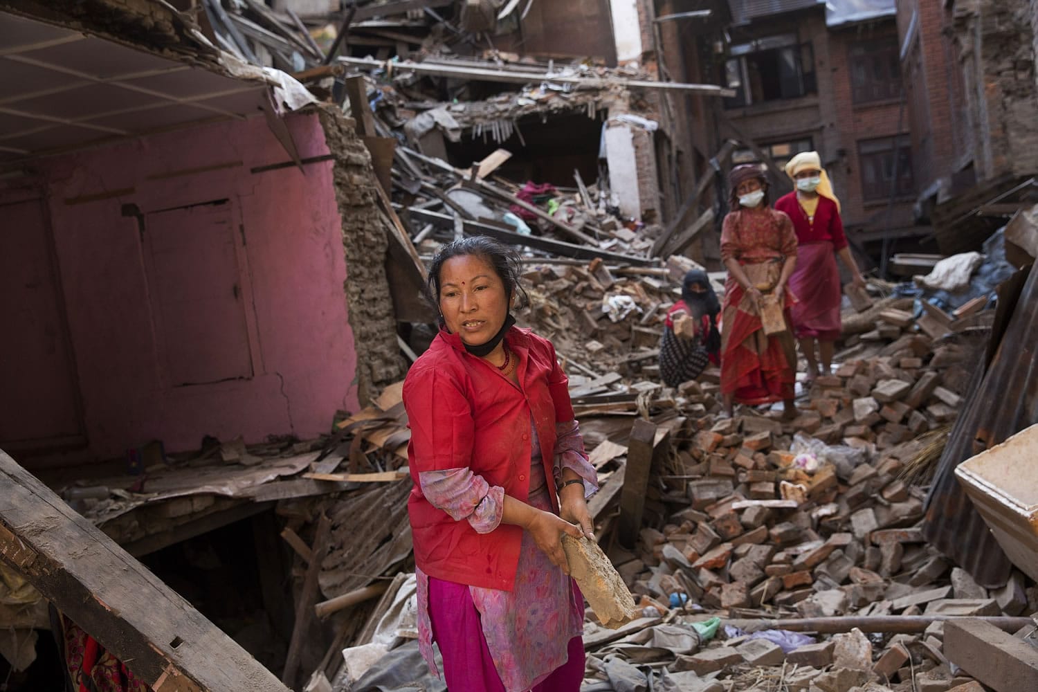 Bernat Amangue/Associated Press
Women search Sunday for belongings from their house that was destroyed in the April 25 quake in Bhaktapur, Nepal. The U.N. says the quake affected 8.1 million people -- more than a quarter of Nepal's 28 million people.