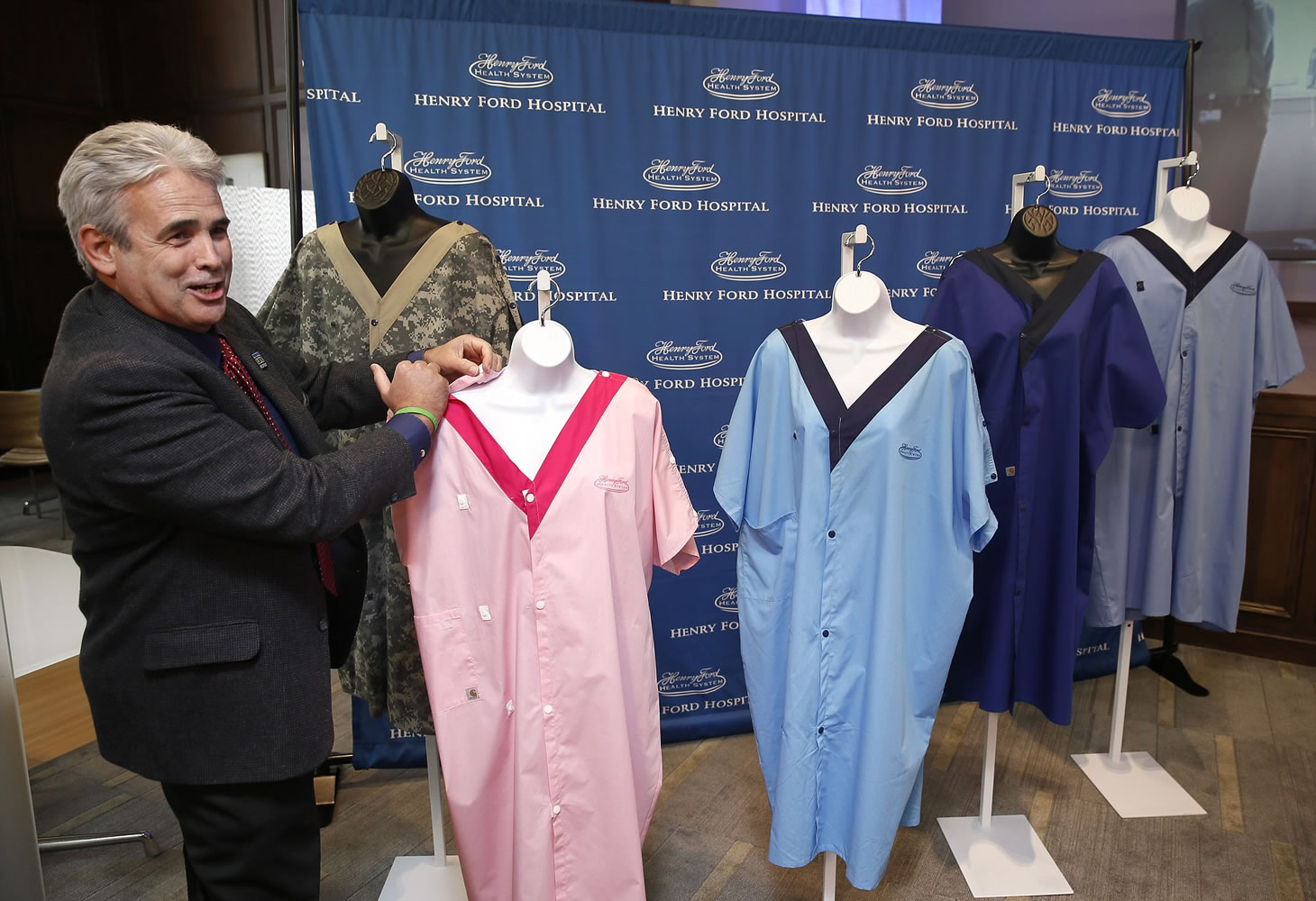 Dale Milford, a Henry Ford Health System transplant patient, who tested the &quot;Model G&quot; gown shows a snap at the Henry Ford Innovation Institute in Detroit Wednesday.