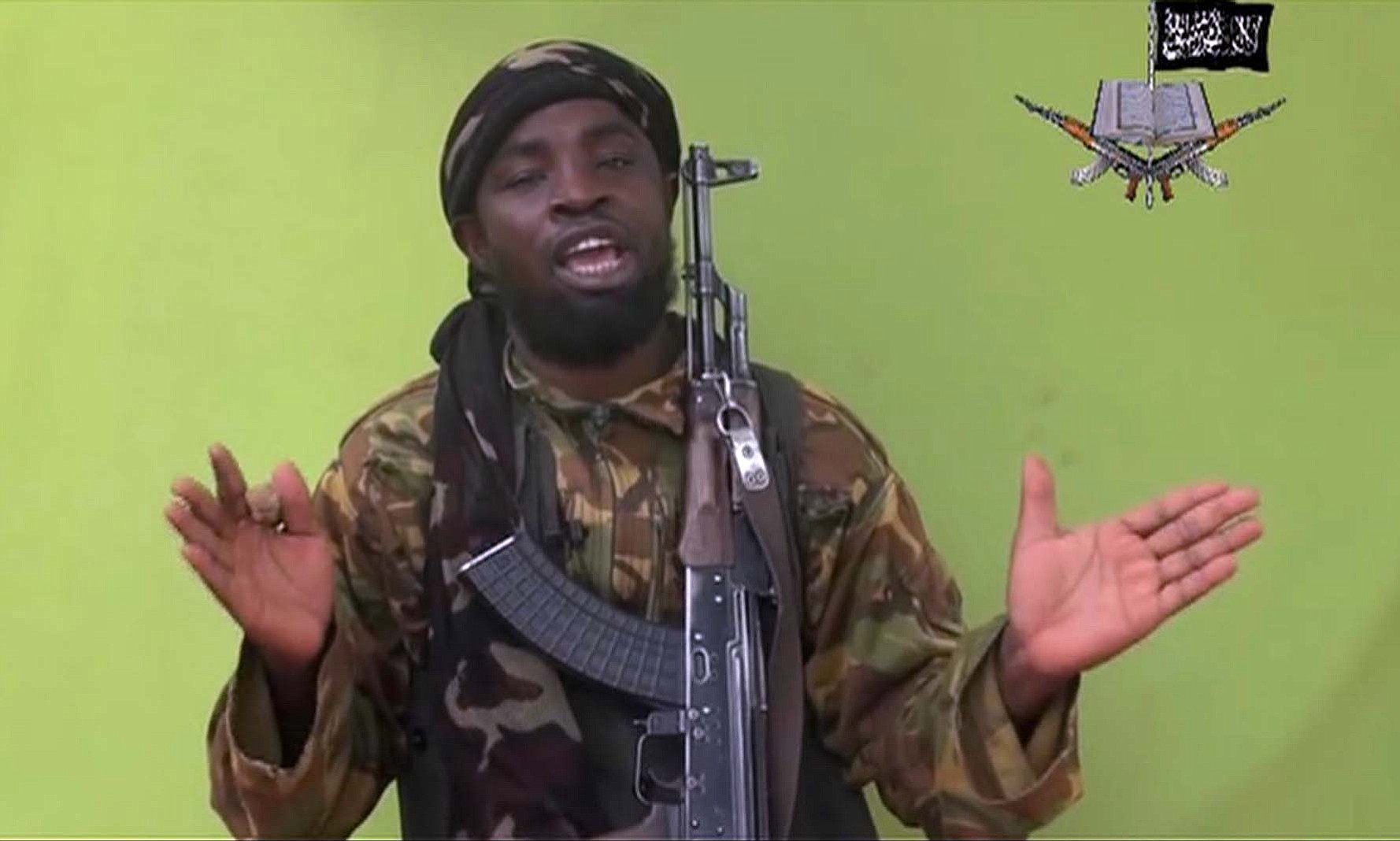 Abubakar Shekau speaks in front of a camera in May. The leader of Nigeria's Islamic extremist group Boko Haram denied agreeing to any cease-fire with the government and said more than 200 kidnapped schoolgirls all have converted to Islam and been married off.