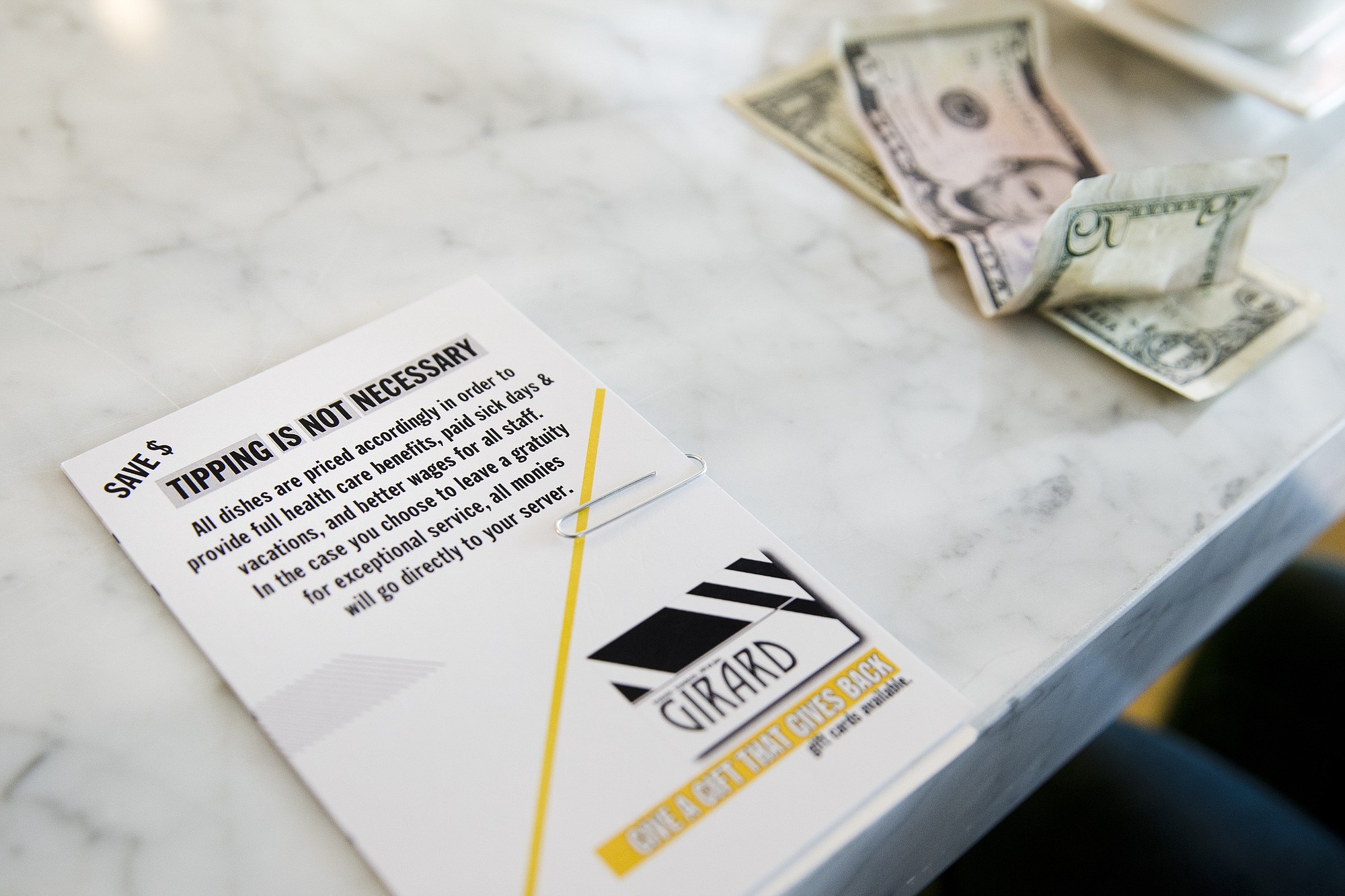 Displayed is a card presented with a bill Tuesday at Girard, a &quot;no-tip&quot; restaurant in Philadelphia.