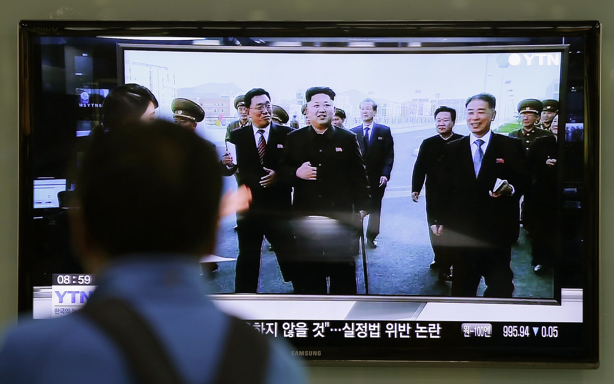 A man watches a TV news program at the Seoul Railway Station in Seoul, South Korea, showing North Korean leader Kim Jong Un using a cane, reportedly during his first public appearance in five weeks in Pyongyang, North Korea.
