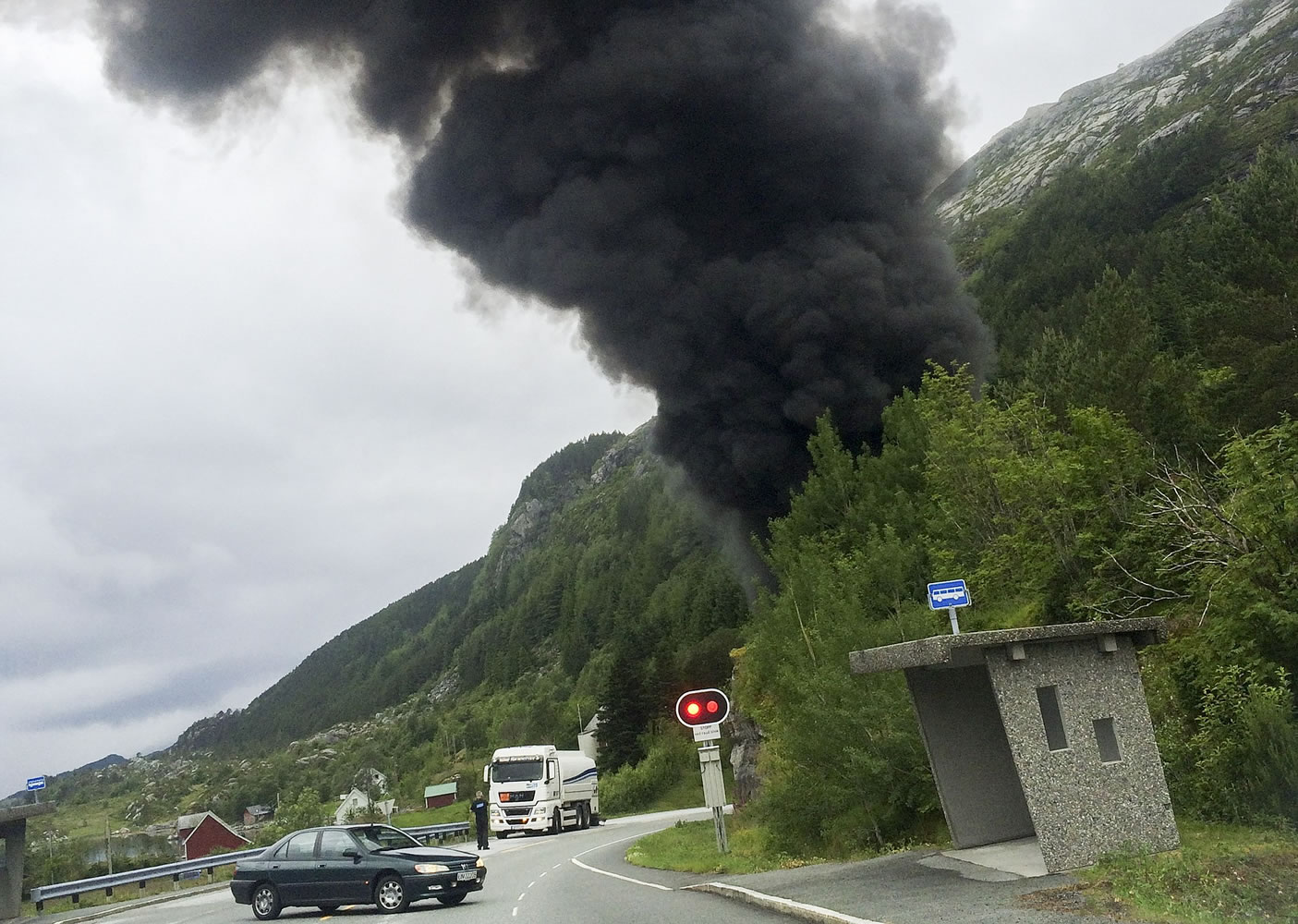 Smoke pours from the Skatestraum tunnel after a fuel truck crashed into the tunnel's side, triggering a series of explosions inside the tunnel in Bremanger, Norway, on Wednesday .