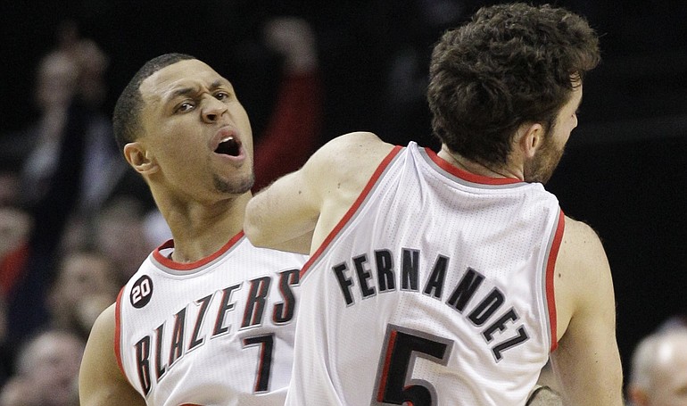 Portland Trail Blazers' Brandon Roy (7) celebrates with teammate Rudy Fernandez (5) after hitting the game-tying 3-pointer near the end of the fourth quarter Friday against Denver.