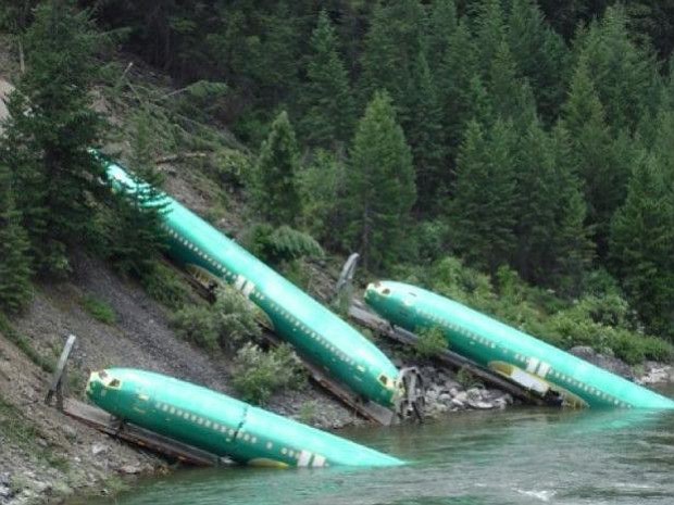 Three Boeing 737 fuselages ended up in a river after the train carrying them derailed.