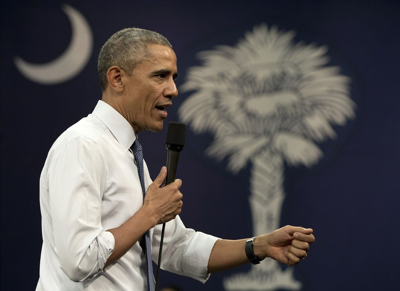 With the flag of South Caroline in the background, President Barack Obama participates in a town-hall meeting at Benedict College on Friday in Columbia, S.C., about the importance of community involvement.