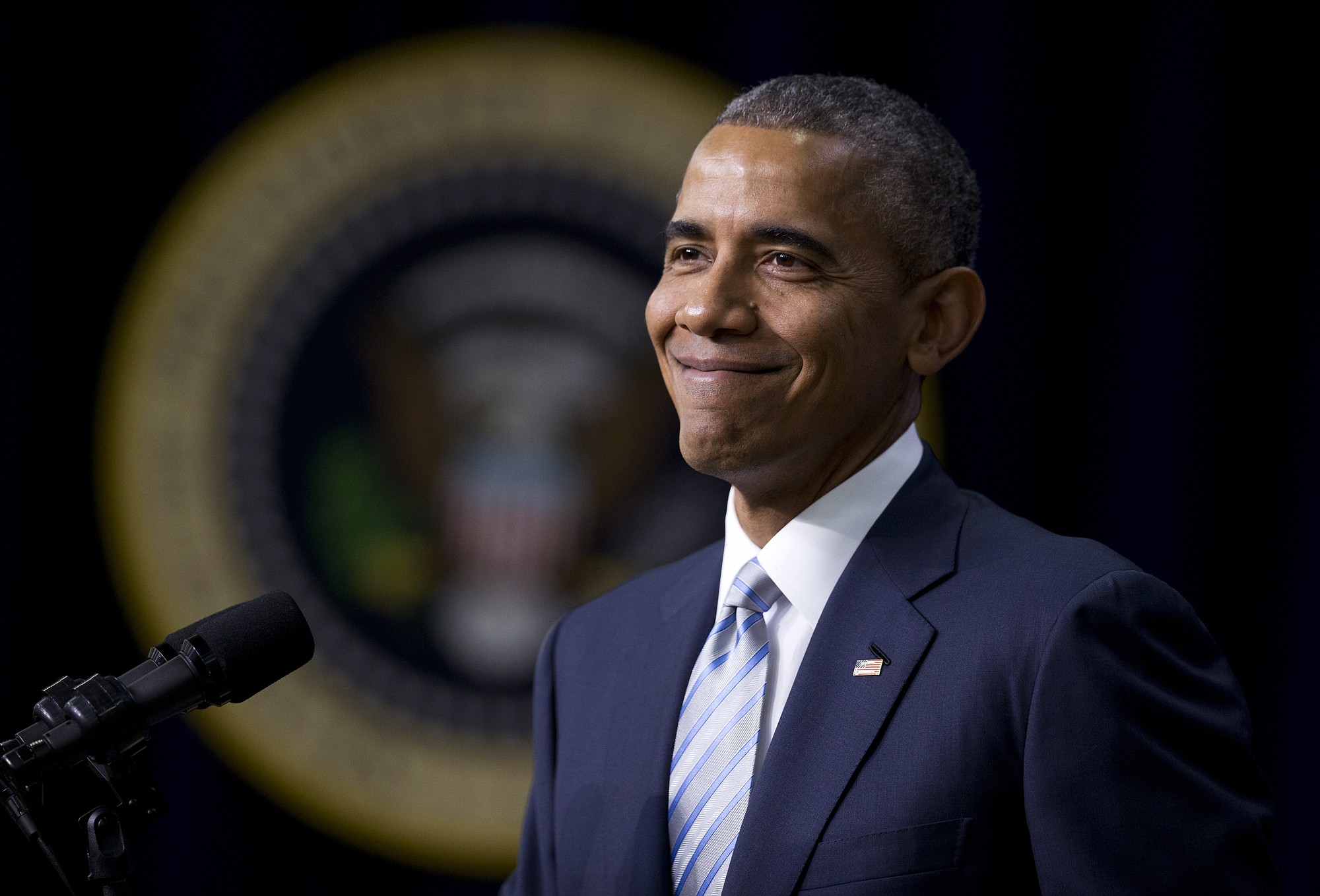 President Barack Obama smiles as he speaks on the fifth anniversary of his healthcare law Wednesday in the South Court Auditorium of the Eisenhower Executive Office Building on the White House complex in Washington.