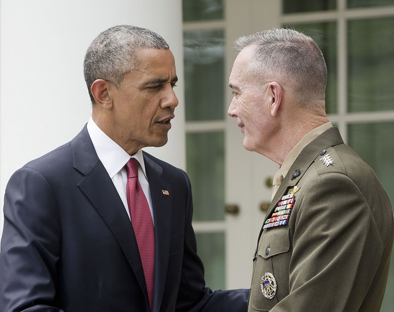 President Barack Obama shakes hands Tuesday with Marine Gen. Joseph Dunford after announcing in the Rose Garden of the White House in Washington, he will nominate Dunford as the next chairman of the Joint Chiefs of Staff. Obama chose the widely respected, combat-hardened commander who led the Afghanistan war coalition during a key transitional period during 2013-2014 to succeed Army Gen.
