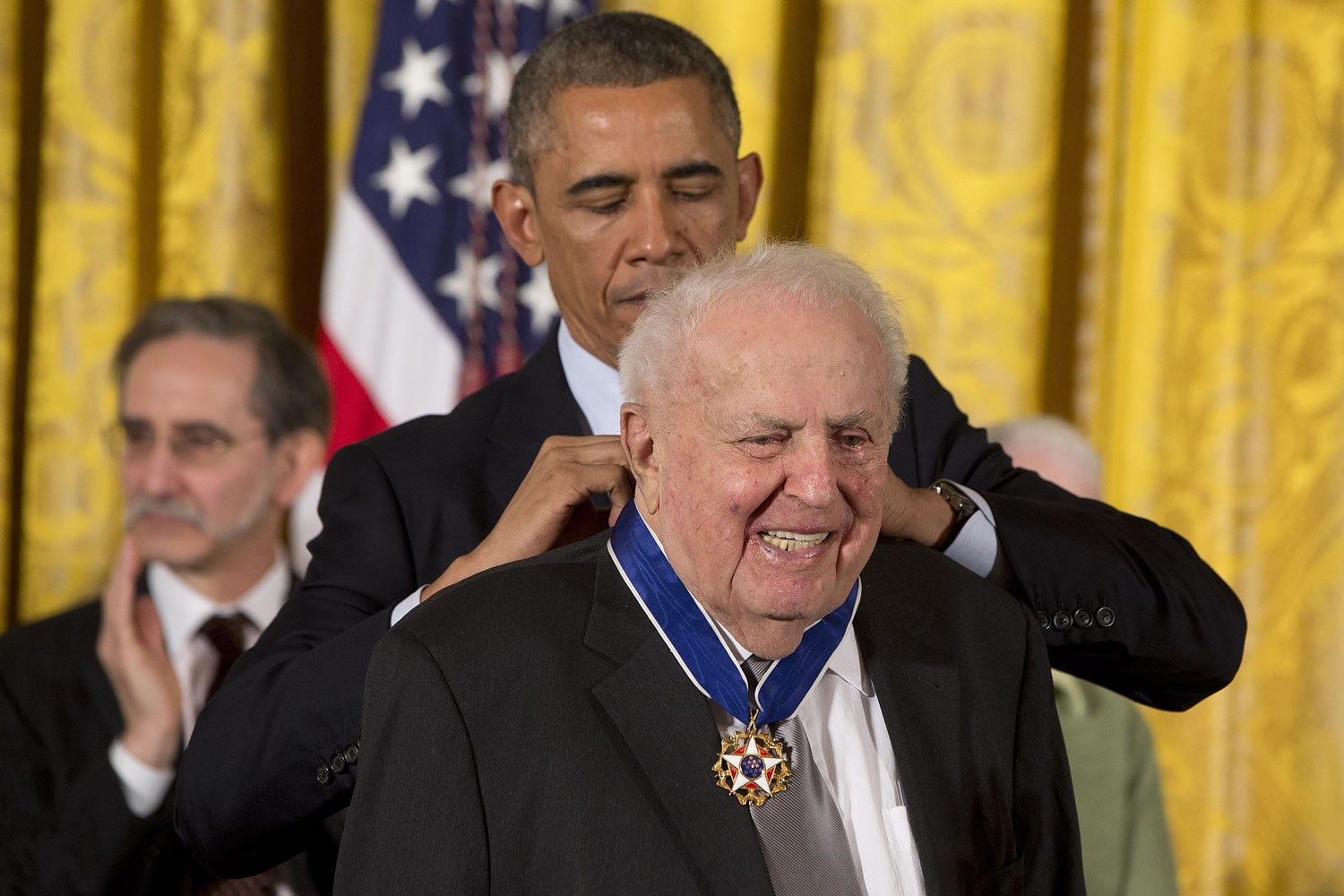 President Barack Obama awards former Illinois Rep. Abner Mikva the Presidential Medal of Freedom, Monday, Nov. 24, 2014, during a ceremony in the East Room of the White House in Washington.