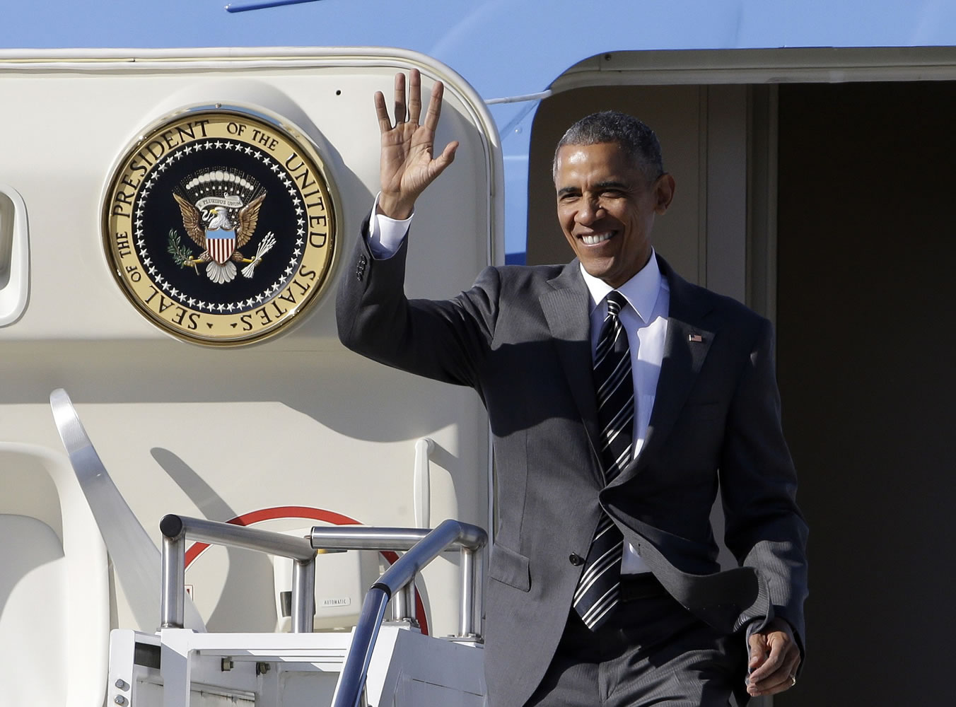 President Barack Obama waves as he arrives in Portland on Thursday. On Friday, the president will visit Nike headquarters in Beaverton, Ore., to make his trade policy pitch as he struggles to win over Democrats for what could be the last major legislative push of his presidency.