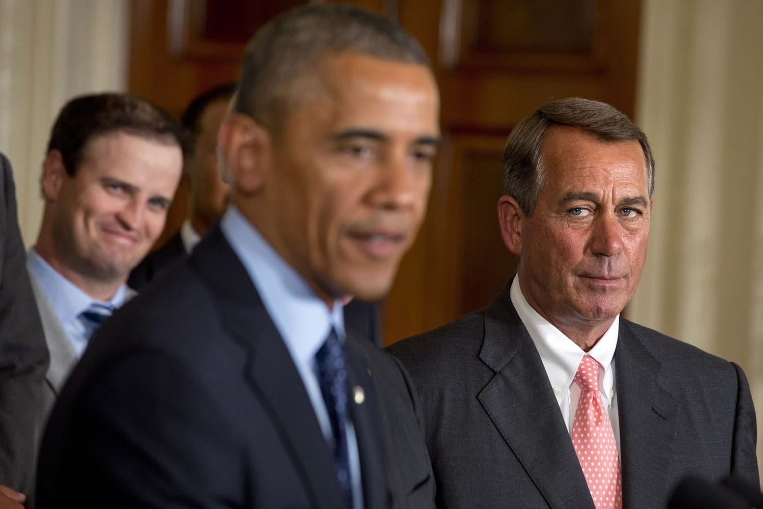 House Speaker John Boehner, R-Ohio, right, watches President Barack Obama speak at an event honoring the 2013 U.S.