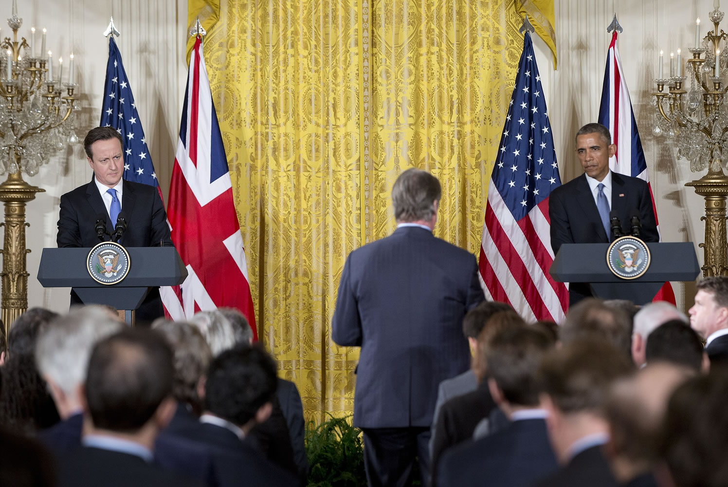 British Prime Minister David Cameron, left, and President Barack Obama hold a ews conference Friday in the East Room of the White House.