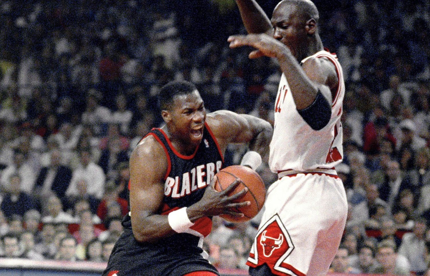 Chicago Bulls' Michael Jordan, right, tries to hold off Portland Trail Blazers' Jerome Kersey during Game 6 in basketball's NBA Finals in Chicago on June 14, 1992. Kersey, the small forward who played his first 11 NBA seasons with the Blazers and helped the San Antonio Spurs win the 1999 title, has died.