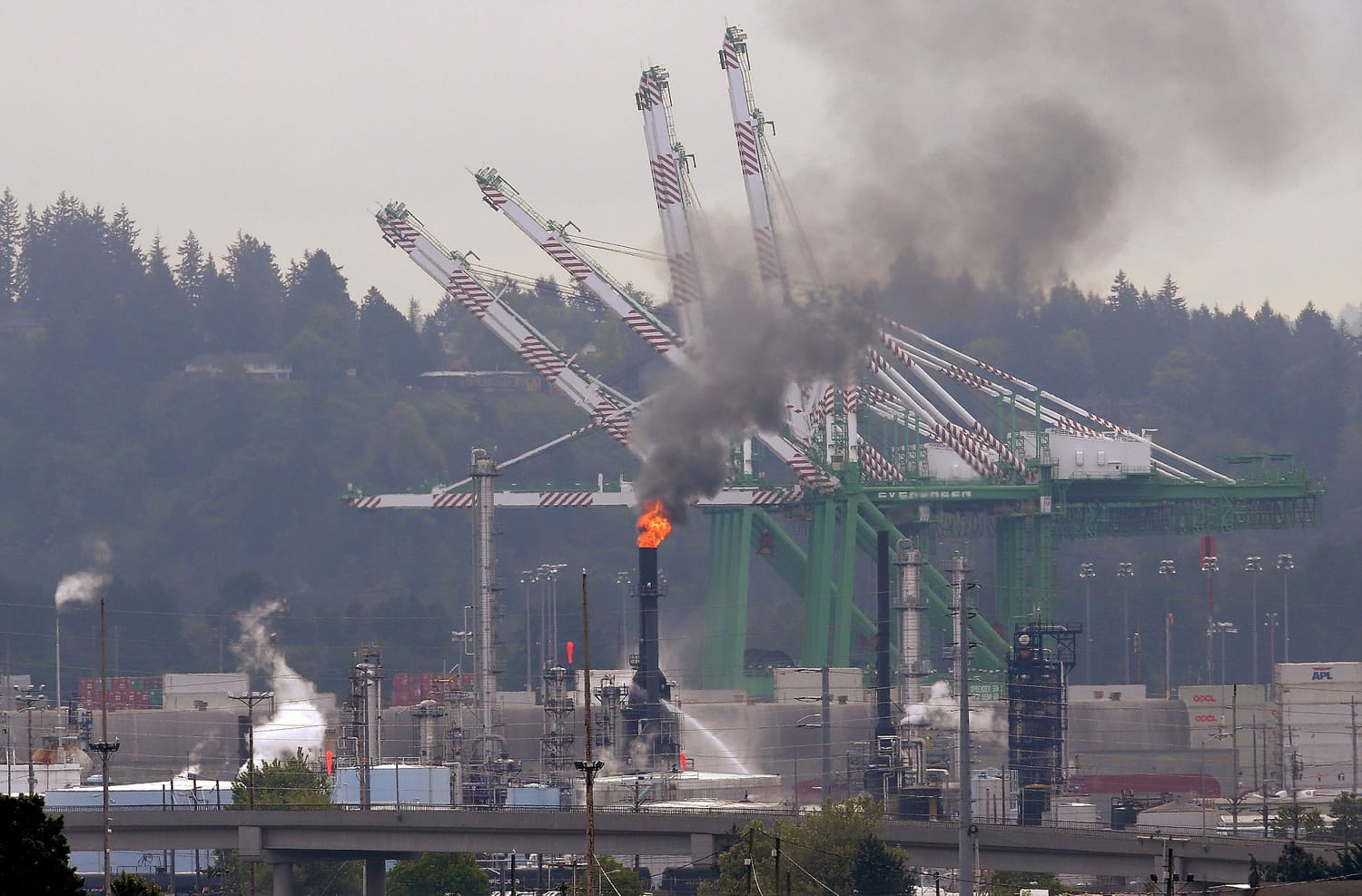 A fire burns at a U.S. Oil and Refining Co. facility Wednesday  in Tacoma .