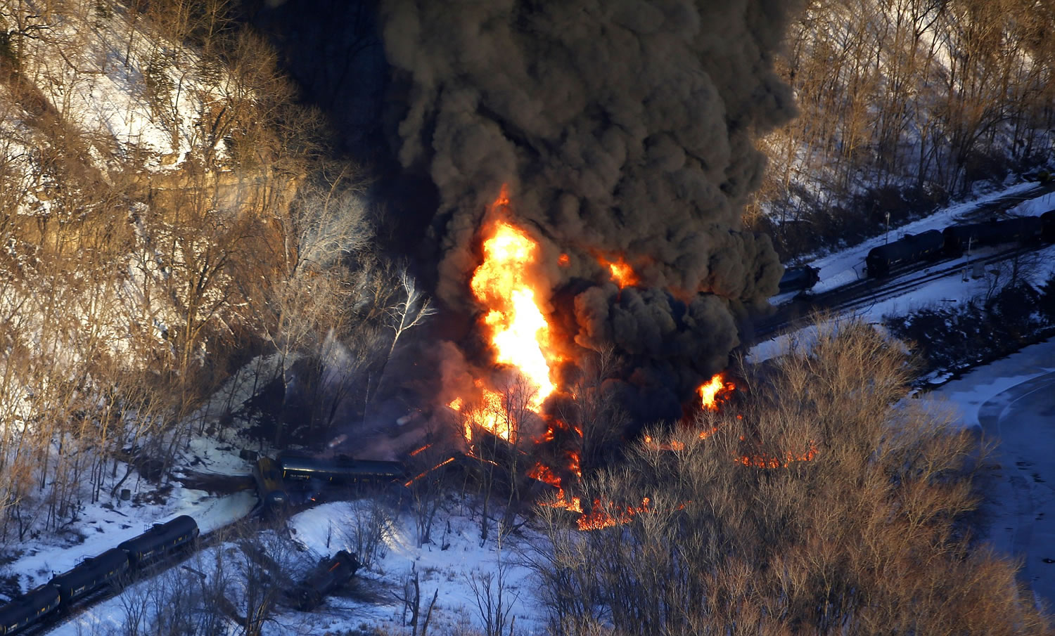 Mike Burley/Telegraph Herald files
Smoke and flames erupt from the scene of a crude oil train derailment March 5 near Galena, Ill. The derailment was one of a string of train crashes that have kept the acting head of the Federal Railroad Administration hopping in her two months on the job.