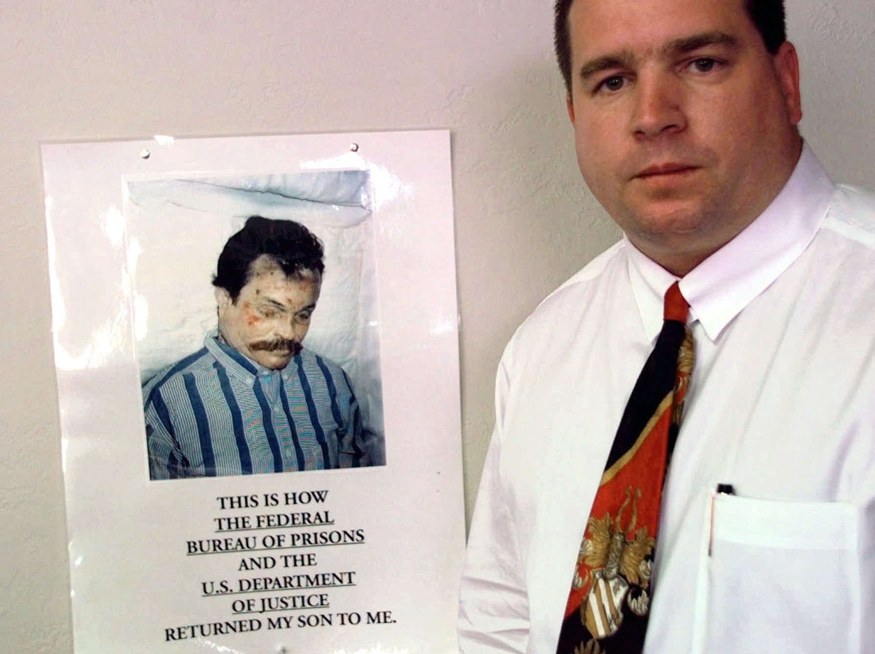 Kenneth Trentadue, shown in the poster hanging in the office of Oklahoma City lawyer Scott Adams, is pictured in Oklahoma City on Oct.