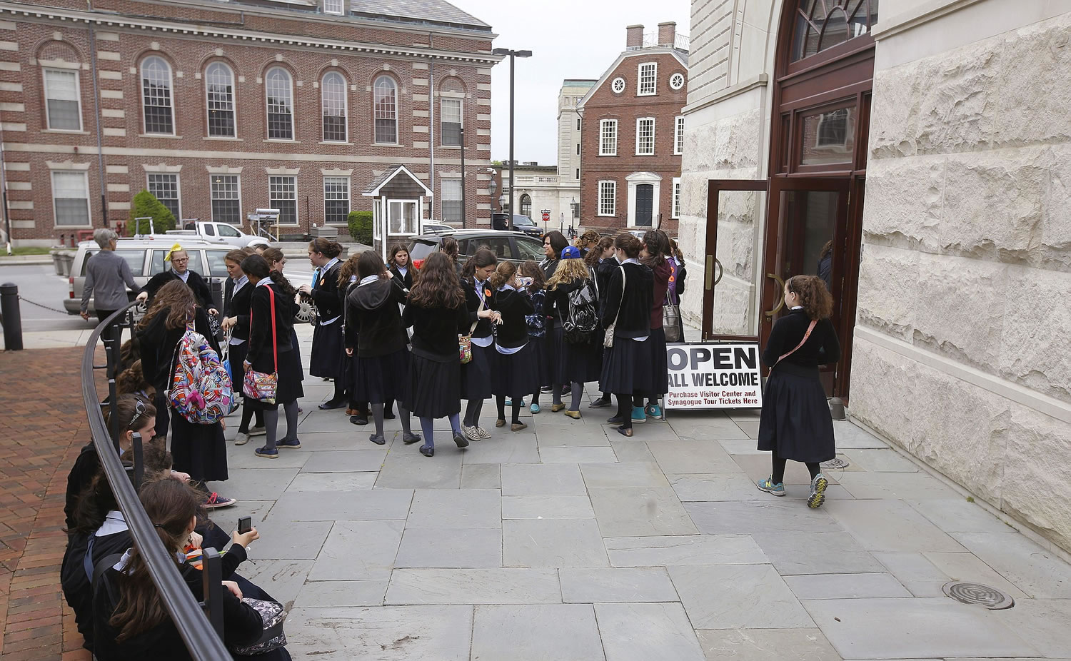 School girls gather outside the visitor's center May 28 at the Touro Synagogue during a tour in Newport, R.I.