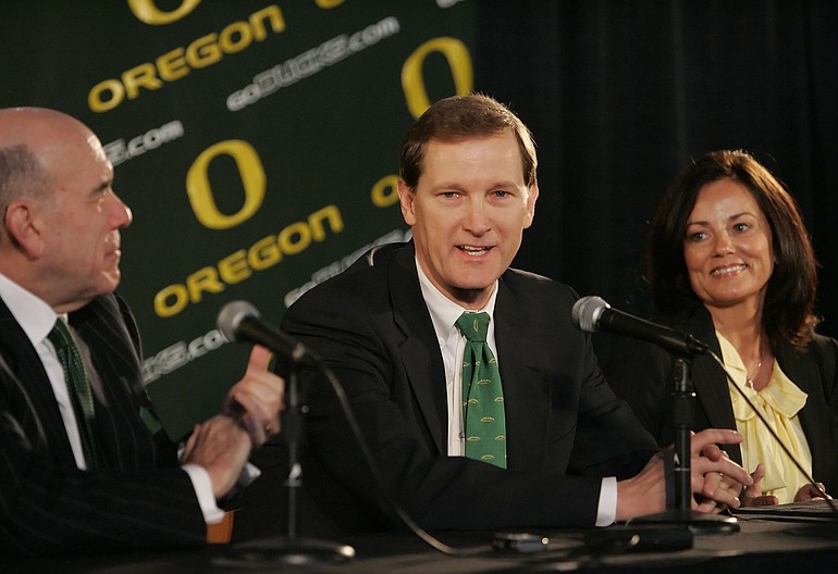 Dana Altman is announced as the new head coach for the Oregon Ducks men's basketball team as his wife Reva Altman and University of Oregon President Richard Lariviere, left, look on, Monday, April 26, 2010 at a news conference in Eugene, Ore.