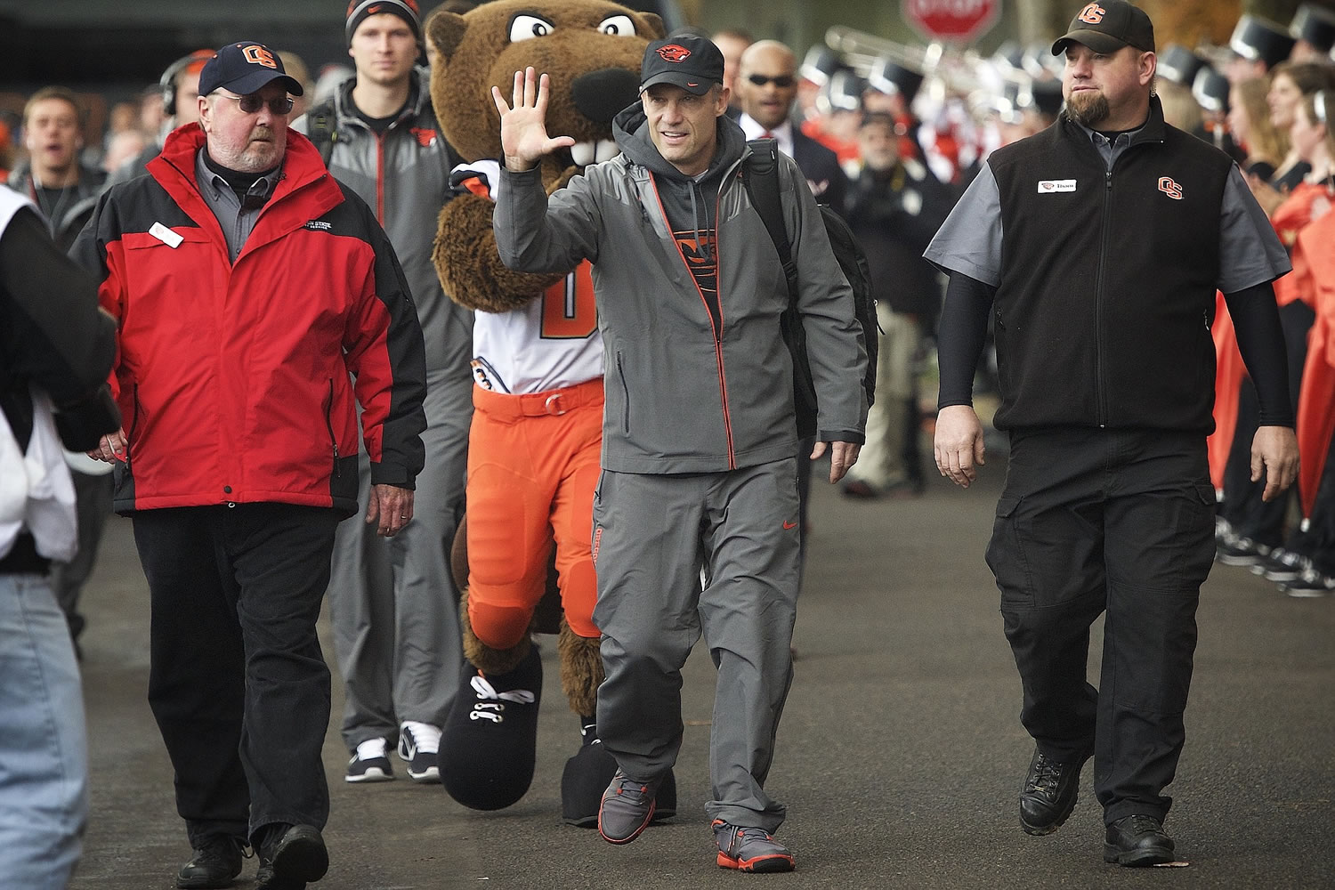 Oregon State football coach Mike Riley waves to fans as the Beavers arrive at Reser Stadium before Saturday's Civil War Game against Oregon.