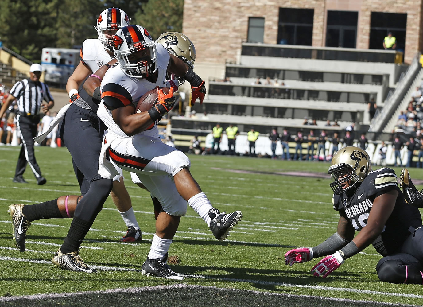 Oregon State running back Terron Ward (28) scores a touchdown against Colorado in the first half at Boulder, Colo., on Saturday, Oct. 4, 2014.