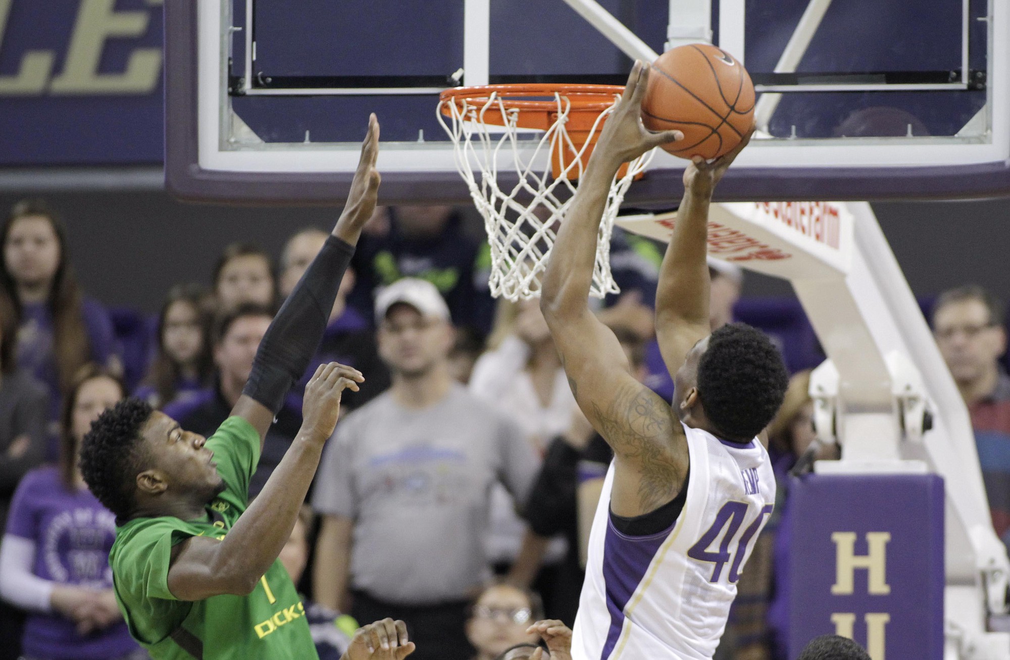 Washington's Shawn Kemp Jr. shoots with Oregon's Jordan Bell defending in the first half Sunday, Jan. 18, 2015, in Seattle.