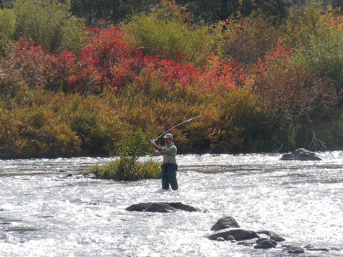 A fisherman casts for trout on the Middle Deschutes near Tumalo State Park, north of Bend, Ore., in September.