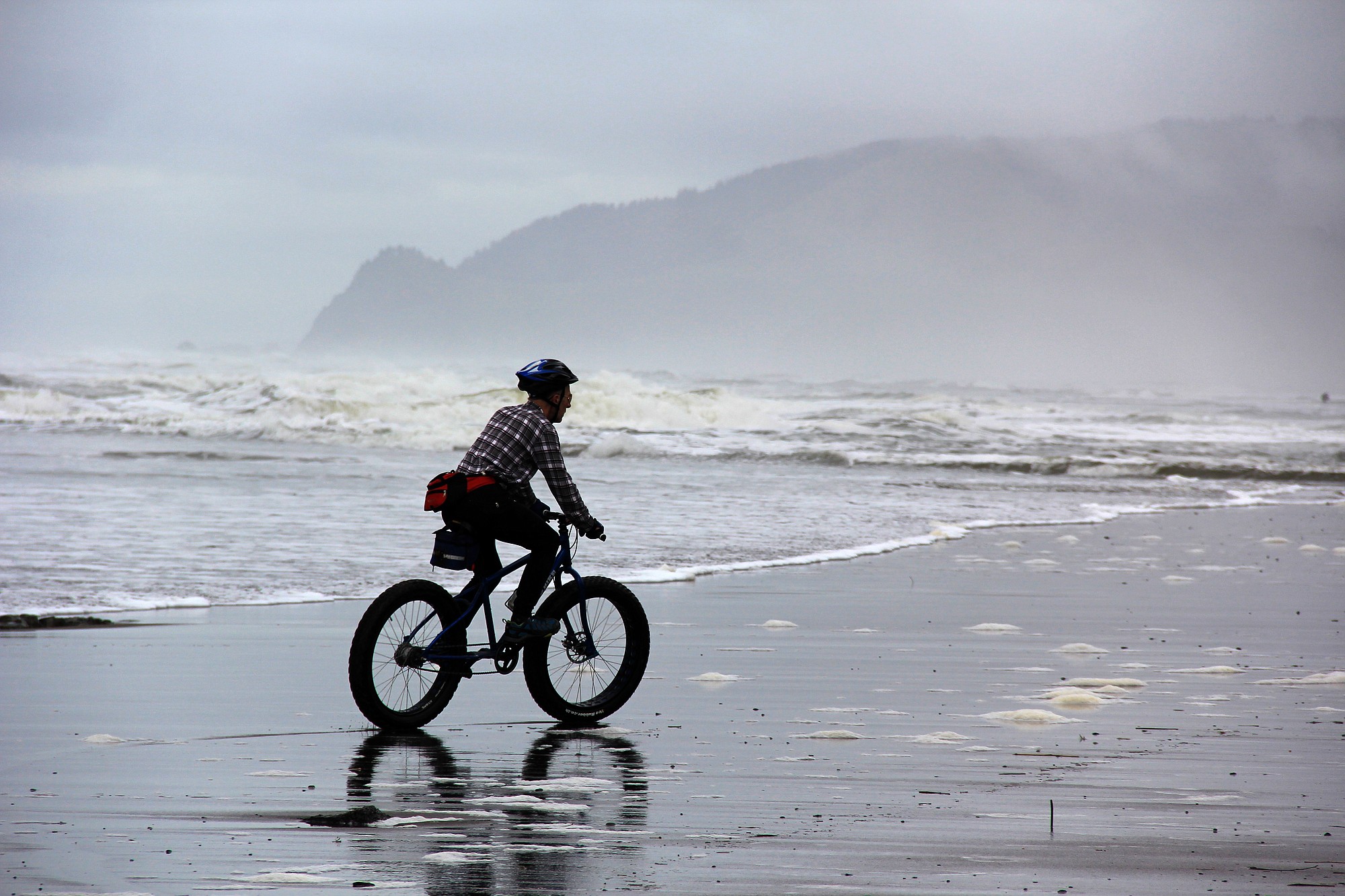 West Salem, Ore., resident Craig Wojcik rides his fat bike Feb. 10 on the Oregon Coast beach in Lincoln City, Ore.