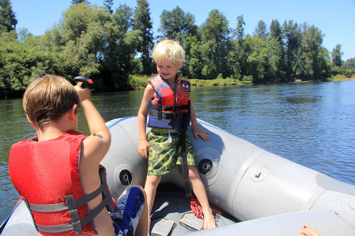 Rylan, 9, and Noah Peters, 6, raft from Spring Valley to Grand Island on the Willamette River near Salem, Ore., in July 2014. The smooth stream with easy vehicle access is a great place for kids to learn to paddle.