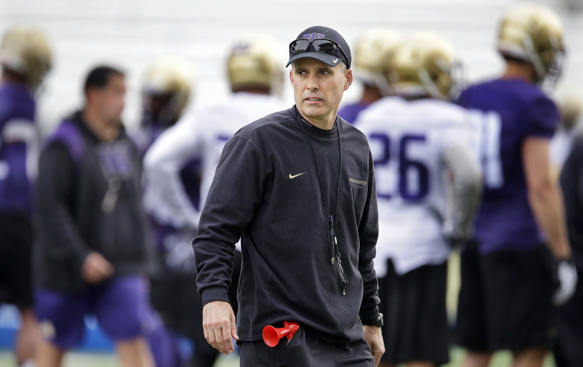 Washington head coach Chris Petersen watches NCAA college football practice drills, Monday, March 30, 2015, on the first day of spring practice in Seattle. (AP Photo/Ted S.
