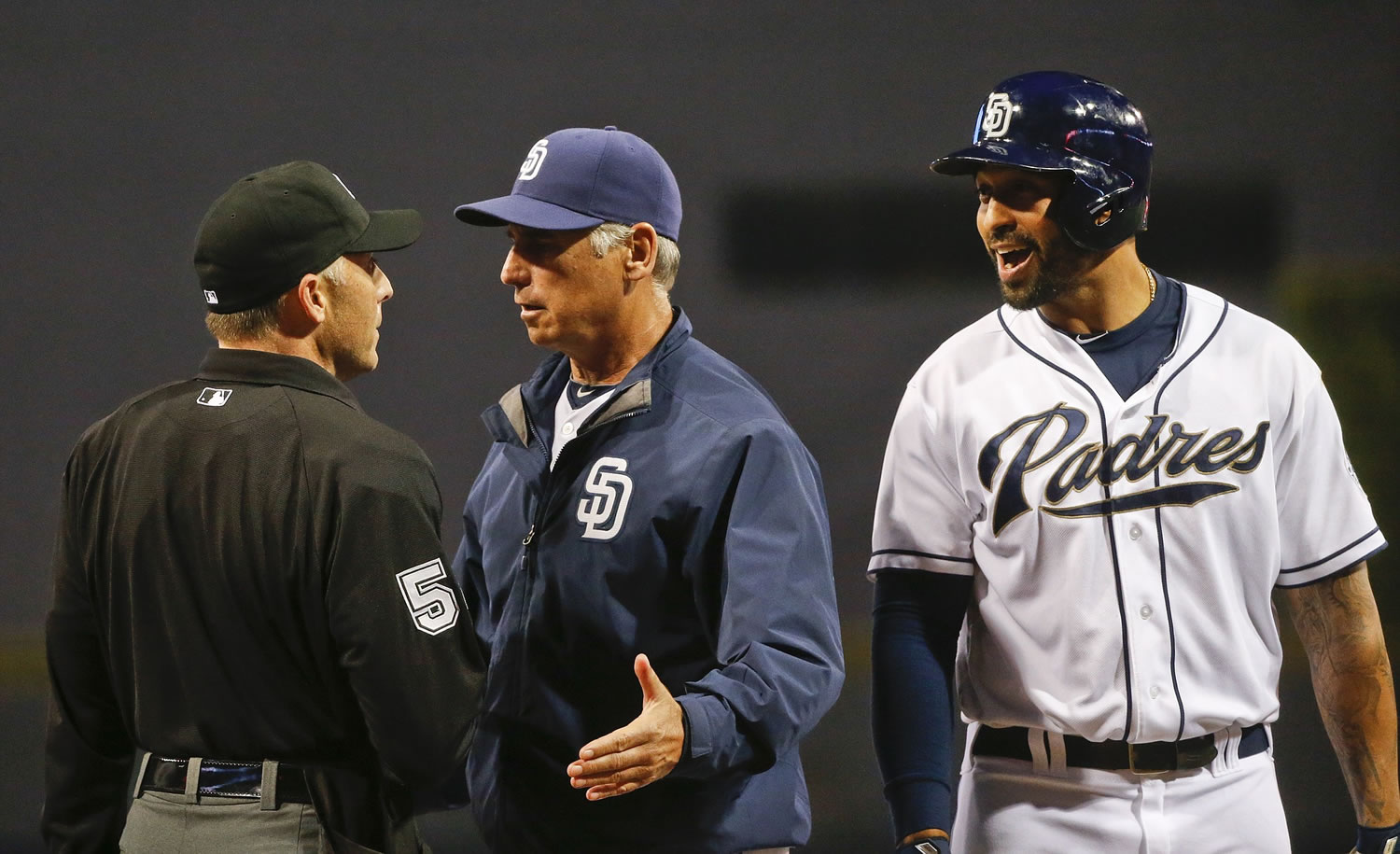 San Diego Padres manager Bud Black attempts a discussion with home plate umpire Dan Iassogna after he was thrown out of the game along with Matt Kemp, right, in the eighth inning against the New York Mets on June 1, 2015, in San Diego.