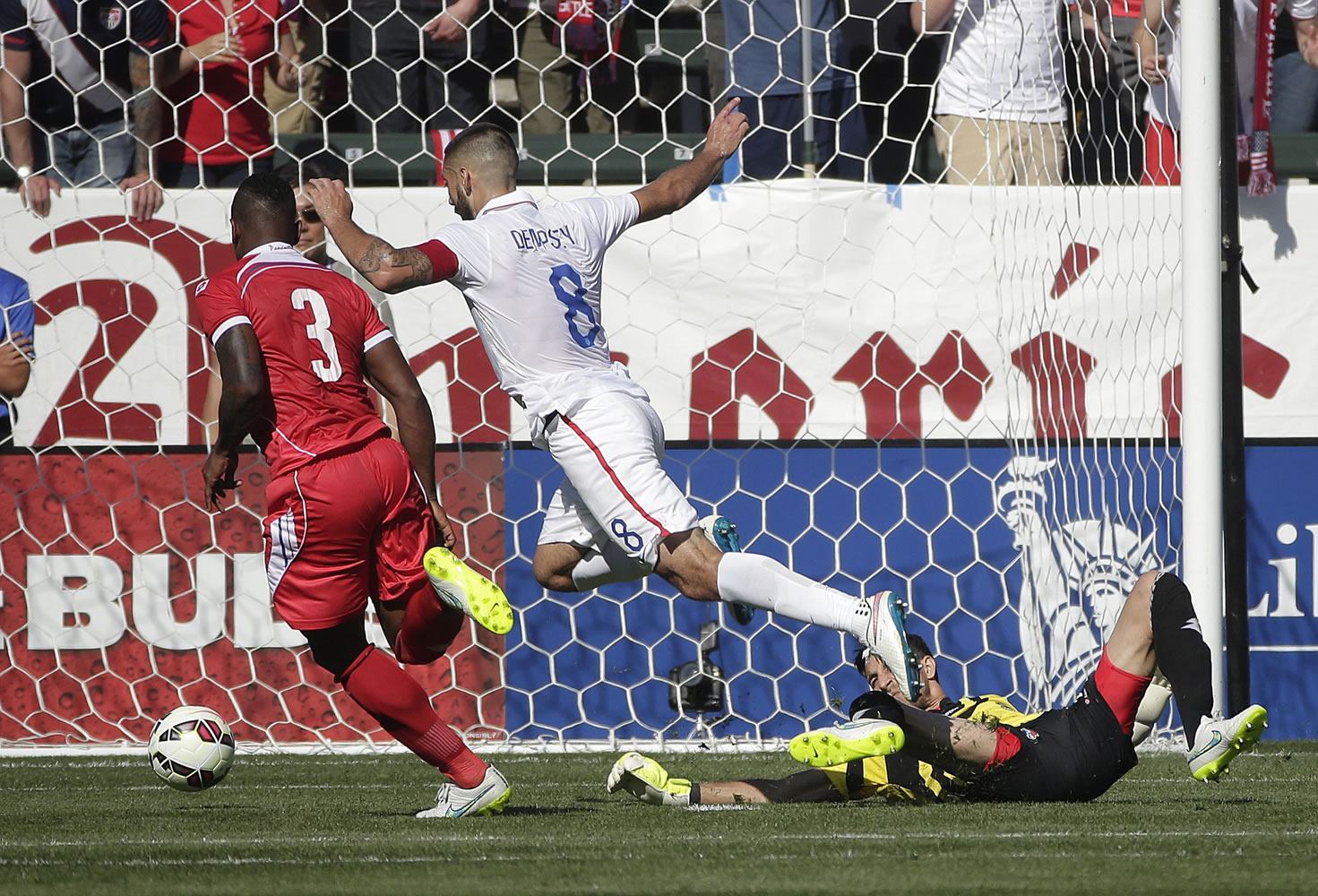 United States' Clint Dempsey, center, moves the ball past Panama goalie Jaime Penedo, right, to score during the first half of a friendly soccer match, Sunday, Feb. 8, 2015, in Carson, Calif. (AP Photo/Jae C.
